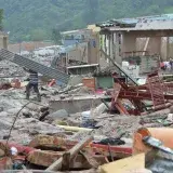 Devastation in Mocoa, Colombia, showing rubble and recovery efforts after a natural disaster.