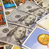 Combination of tarot cards and U.S. dollar bills symbolizing financial prosperity and mysticism.