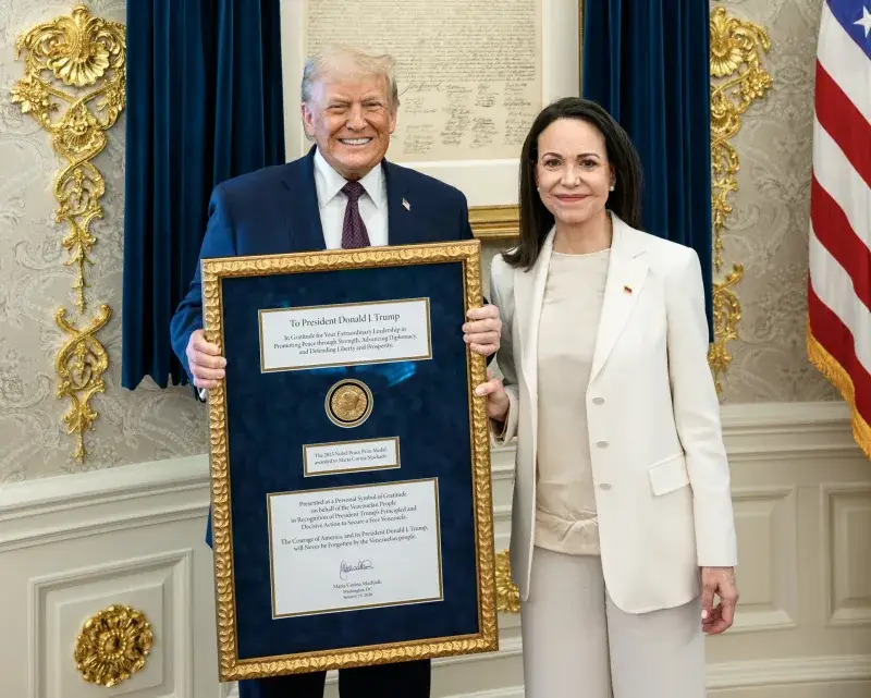 File:2026 gift to President Donald Trump of the Nobel Peace Prize medal awarded to Maria Corina Machado at the White House Oval Office on 15 January (cropped).jpg
