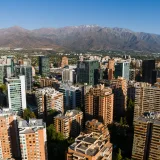 Aerial view of Santiago de Chile skyline with the Andes Mountains in the background.