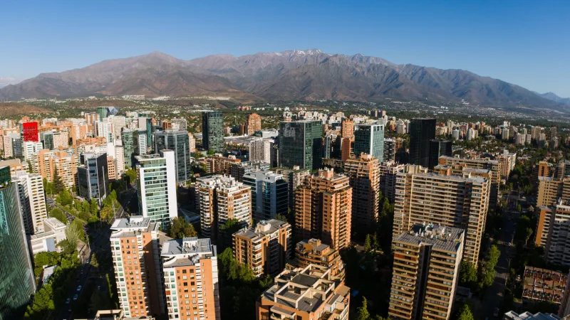 Aerial view of Santiago de Chile skyline with the Andes Mountains in the background.
