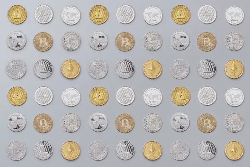A seamless pattern of various cryptocurrency coins in gold and silver tones.