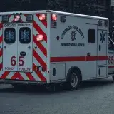 A Chicago Fire Department Ambulance on duty in urban city streets, showcasing emergency response vehicles.
