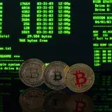Bitcoin coins in front of a vintage computer screen displaying DOS commands, symbolizing digital currency.