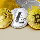 Close-up of various cryptocurrency coins including Bitcoin, EOS, and Litecoin on a colorful background.