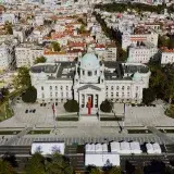 Drone shot of the National Assembly building in Belgrade, Serbia’s architectural landmark surrounded by cityscape.