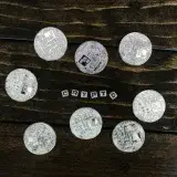 Silver cryptocurrency coins arranged on a wooden surface spelling 'crypto'.
