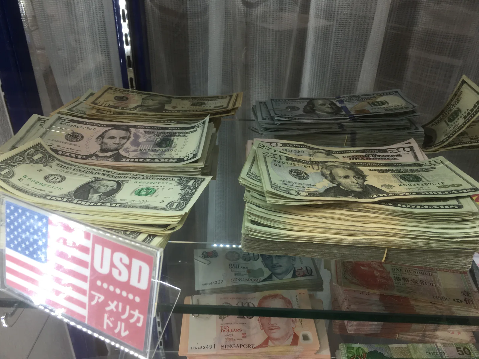 File:American dollar in stacks Tokyo area - Jan 2020.jpeg