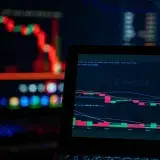 Bright trading screens depict cryptocurrency market trends in a tech setup.