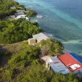 Stunning aerial view showcasing the seascape and lush greenery of Ocumare de la Costa, Aragua.