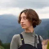 Woman gazes into the distance with scenic mountains in Bogotá, Colombia.