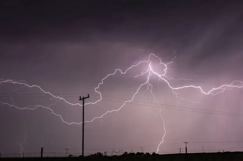 Captivating long exposure shot of a lightning storm over power lines in KwaZulu-Natal, South Africa.