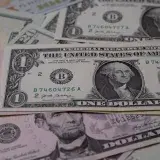 A detailed view of multiple denominations of US dollar bills symbolizing wealth and finance.