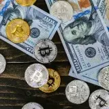Colorful mix of bitcoins and US dollar bills, showcasing cryptocurrency and finance investment.