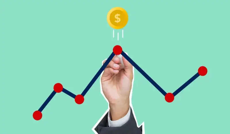 Cutout paper appliques of hand with chalk drawing graph under coin with dollar symbol on green background