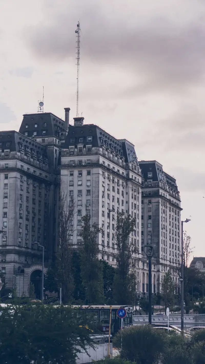 View of the historic Ministry of Defense building in Buenos Aires, Argentina under overcast skies.