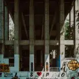 Vibrant street art mural on a concrete bridge in Mérida, Venezuela.