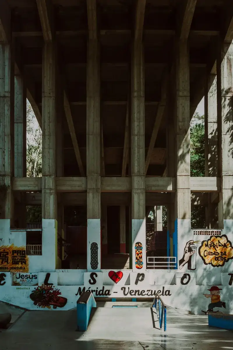 Vibrant street art mural on a concrete bridge in Mérida, Venezuela.