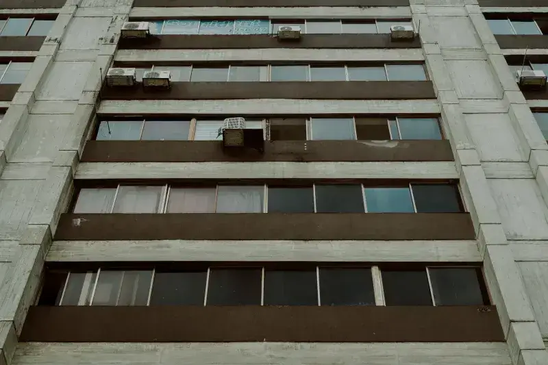 Low angle view of a modern apartment building facade with windows, Mérida, Venezuela.