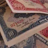 Close-up of colorful vintage banknotes showcasing detailed designs and historical currencies.