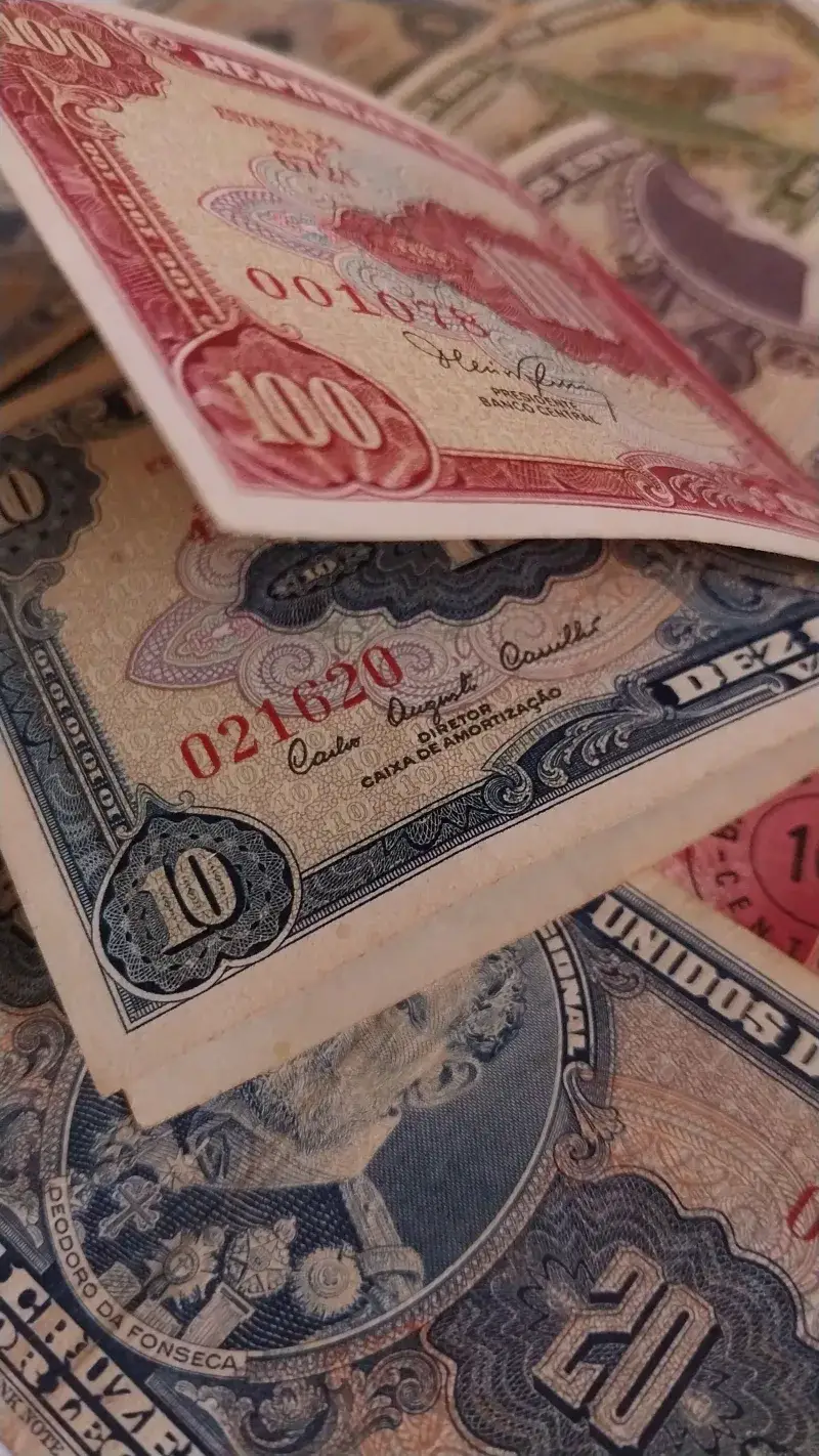 Close-up of colorful vintage banknotes showcasing detailed designs and historical currencies.