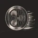 Monochrome image of Ripple coins stacked vertically, symbolizing digital currency.