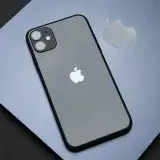 Stylish Apple iPhone on a MacBook, showcasing modern technology and design.