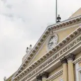 Historic building facade with clock in Toluca de Lerdo, Estado de México, featuring classical architecture.