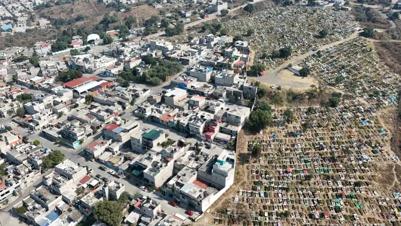 Drone shot showcasing the urban landscape and cemetery in Estado de México, México.