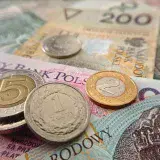 Close-up of Polish coins and banknotes, showcasing zloty currency details.