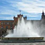 Beautiful view of the fountain at Plaza de España, Seville, on a sunny day.