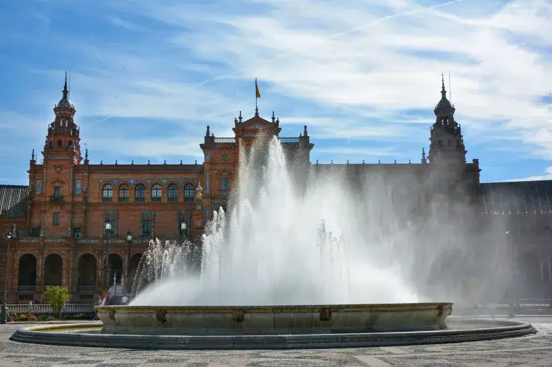 Beautiful view of the fountain at Plaza de España, Seville, on a sunny day.