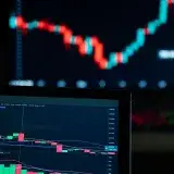 Detailed view of cryptocurrency trading charts on digital screens, showcasing market fluctuations.