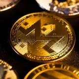 Shiny gold Monero coin close-up, focusing on digital currency aesthetics and investment potential.
