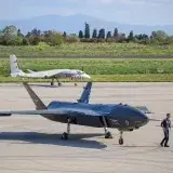 Advanced military drones on a tarmac in Istanbul, Turkey, showcasing modern aerial technology.