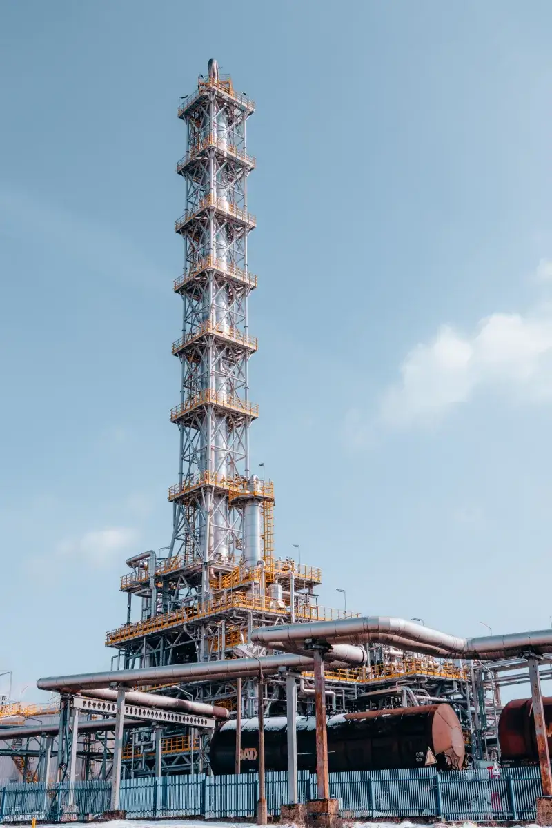 A towering industrial refinery structure in Trzebinia, Lesser Poland Voivodeship.