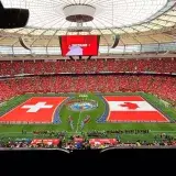 A vibrant soccer match between Switzerland and Canada in BC Place, Vancouver.