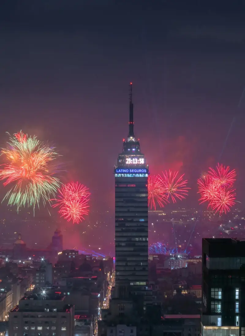 Night fireworks around Torre Latinoamericana in Mexico City's historic center.