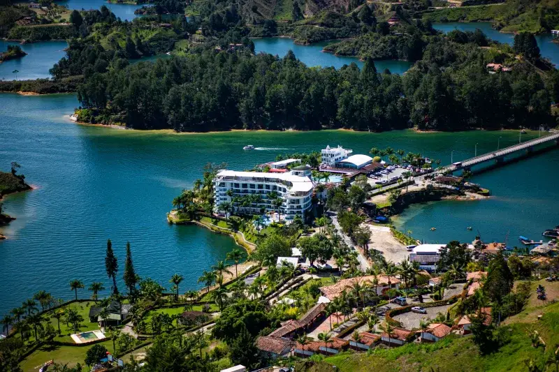 Breathtaking aerial view of Guatapé Lake with surrounding landscape and resort in Antioquia, Colombia.