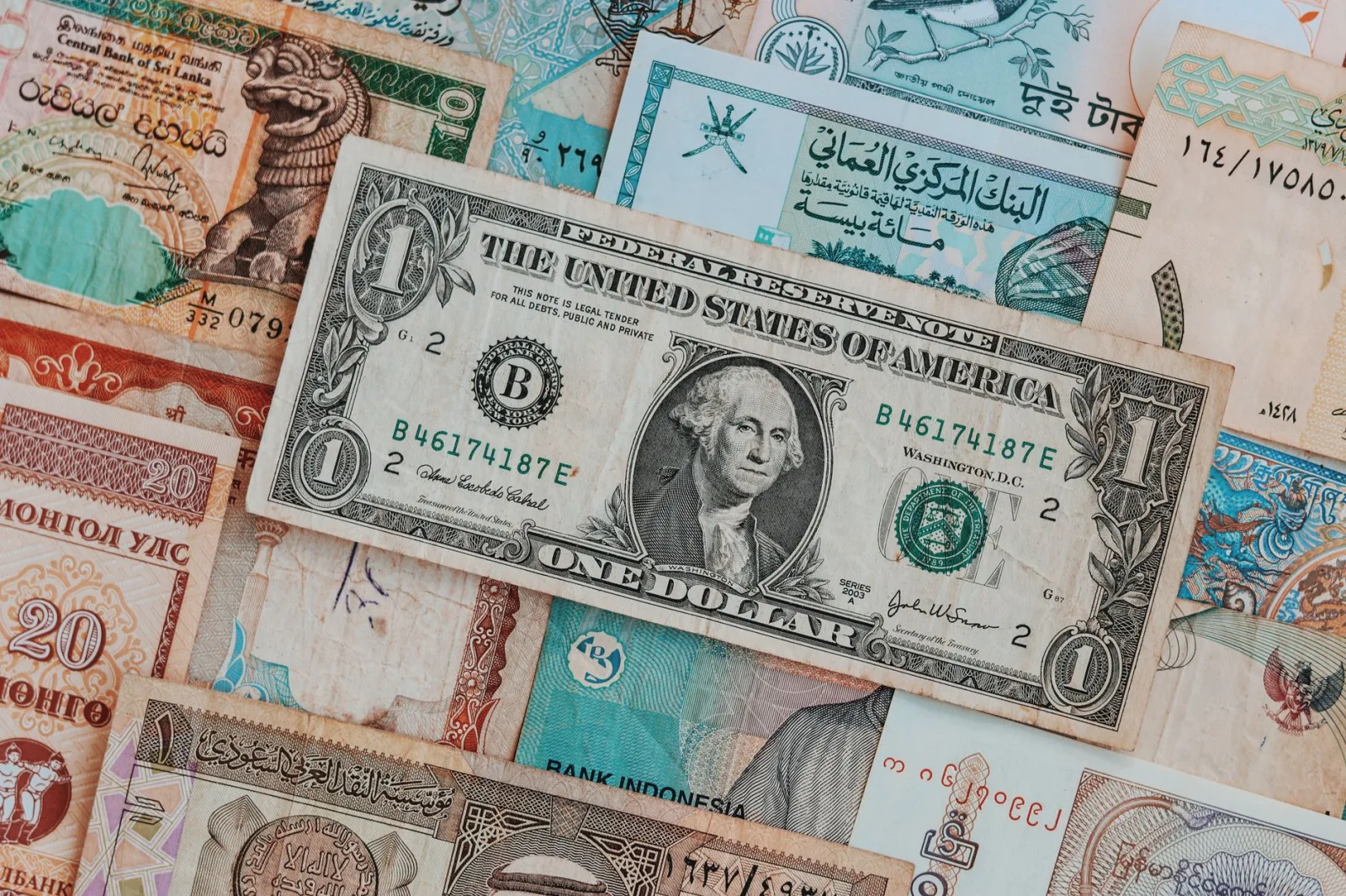 Top view of assorted paper money with American greenback representing image of President and numbers with words and signature on bill