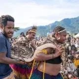 A vibrant cultural celebration in Papua New Guinea featuring traditional attire and performances.