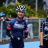 Teen cyclists in vibrant sportswear ready for a competition in Bogotá, Colombia.