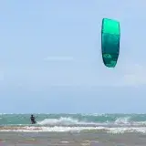 Exciting kiteboarding scene in Adicora, Venezuela, showcasing dynamic water sports action.