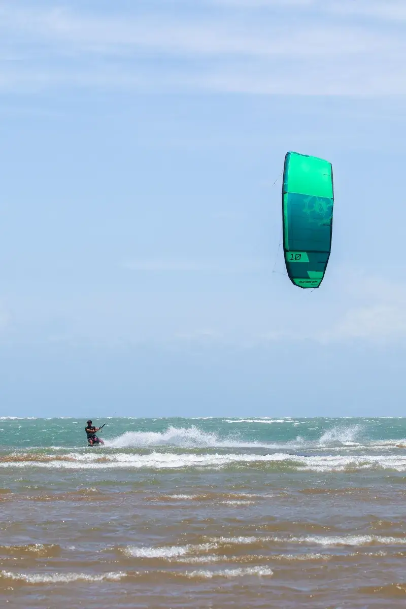 Exciting kiteboarding scene in Adicora, Venezuela, showcasing dynamic water sports action.