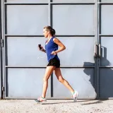 Older female jogging outdoors