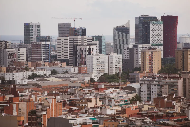 Panoramic view of Barcelona's skyline showcasing modern skyscrapers and residential buildings.