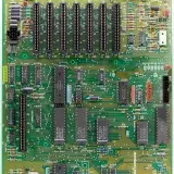 Close-up of a vintage Apple II motherboard showcasing circuits and components.