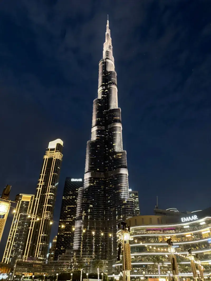 A breathtaking view of the illuminated Burj Khalifa towering against the night sky in Dubai.