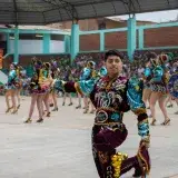 Traditional dancers perform at a vibrant festival in Imperial, Lima, Peru.