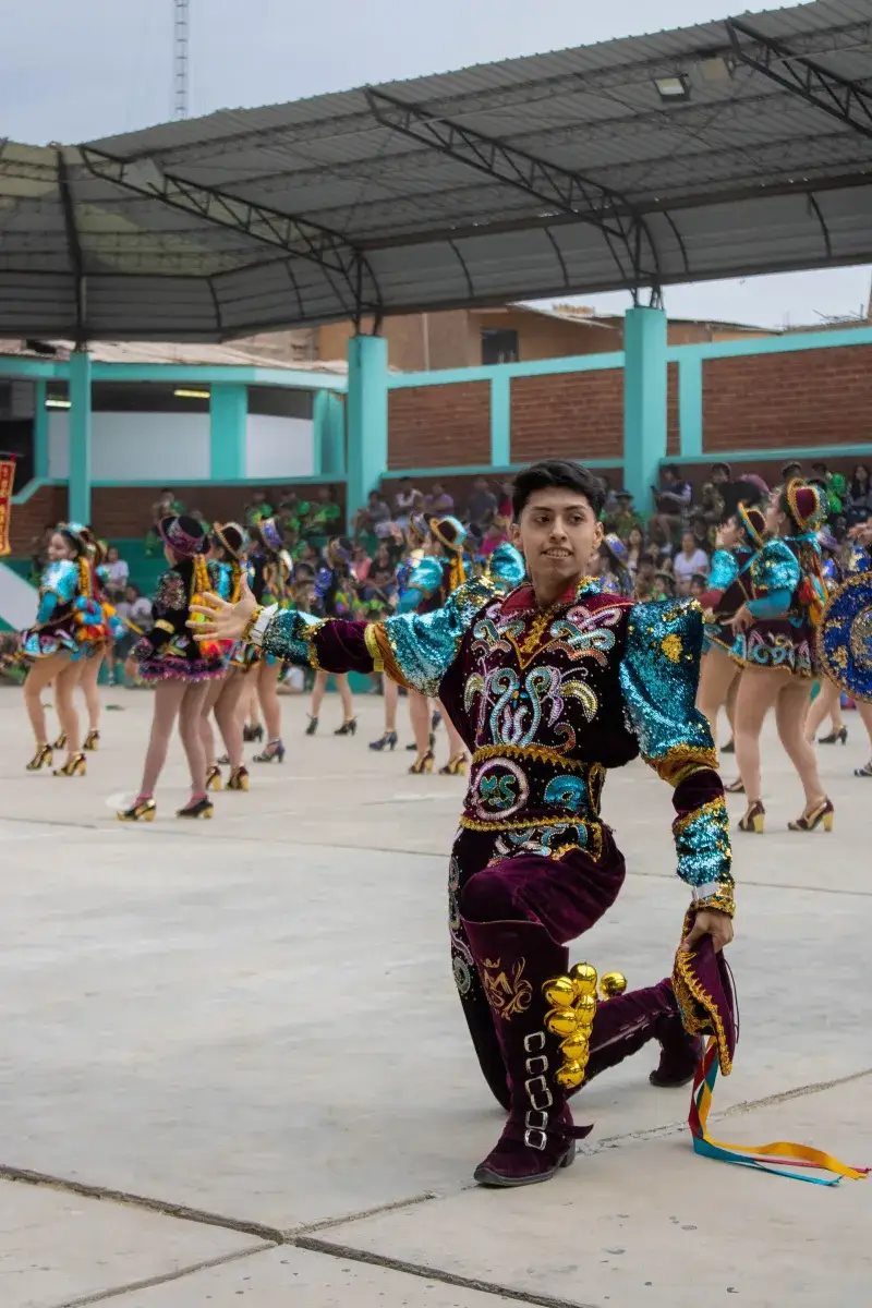 Traditional dancers perform at a vibrant festival in Imperial, Lima, Peru.